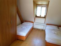 Postel nebo postele na pokoji v ubytování Žabonosy Mlýn