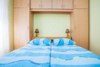 Łóżko lub łóżka w pokoju w obiekcie Holiday apartment IVICA