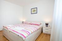 Łóżko lub łóżka w pokoju w obiekcie Holiday apartment IVICA