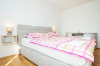 Łóżko lub łóżka w pokoju w obiekcie Holiday apartment IVICA