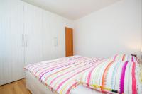 Łóżko lub łóżka w pokoju w obiekcie Holiday apartment IVICA