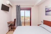 Posteľ alebo postele v izbe v ubytovaní Hotel Olympia Ronda I