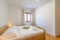 Posteľ alebo postele v izbe v ubytovaní Apartments Coronata