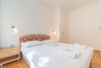 Posteľ alebo postele v izbe v ubytovaní Apartments Coronata