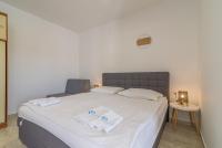 Posteľ alebo postele v izbe v ubytovaní Apartments Coronata