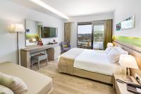 A television and/or entertainment centre at Akti Imperial Deluxe Resort & Spa Dolce by Wyndham