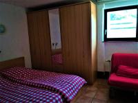 A bed or beds in a room at Haus Taekema Appartments