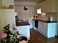 A kitchen or kitchenette at Haus Taekema Appartments