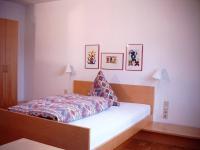 a small bedroom with a bed with a white mattress at Fritz&#39;es Goldener Stern in Schauenburg