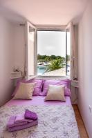 Posteľ alebo postele v izbe v ubytovaní Lovely apartment near the beach with a sea view