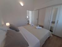 Posteľ alebo postele v izbe v ubytovaní Apartman s pogledom