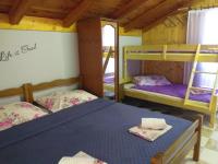 Postel nebo postele na pokoji v ubytování Apartments Vidic