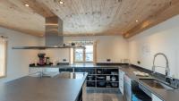 A kitchen or kitchenette at alpen select lodge Kleinwalsertal