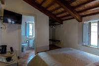 Łóżko lub łóżka w pokoju w obiekcie Santa Cecilia Perugia - Rooms&Suite