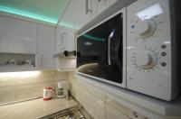 Kuchyňa alebo kuchynka v ubytovaní Amália Apartman