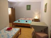 Postel nebo postele na pokoji v ubytování Apartments Vidic