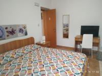 A bed or beds in a room at Santa e Maria Affittacamere