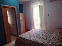 A bed or beds in a room at Santa e Maria Affittacamere