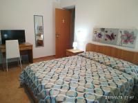 A bed or beds in a room at Santa e Maria Affittacamere