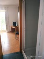 A television and/or entertainment centre at Santa e Maria Affittacamere