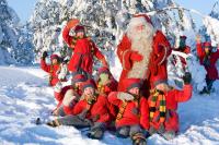 a group of children posing with santa claus in the snow at Original Sokos Hotel Vaakuna Rovaniemi in Rovaniemi