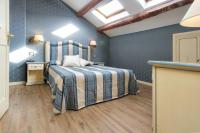 A bed or beds in a room at Hotel Conterie