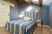 A bed or beds in a room at Hotel Conterie