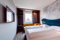 Posteľ alebo postele v izbe v ubytovaní Hotel Rainers21