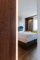 Posteľ alebo postele v izbe v ubytovaní Hotel Rainers21