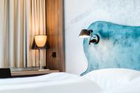 Posteľ alebo postele v izbe v ubytovaní Hotel Rainers21