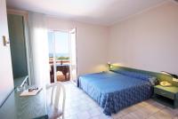 Posteľ alebo postele v izbe v ubytovaní Hotel Residence Isola Verde
