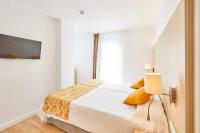 Łóżko lub łóżka w pokoju w obiekcie Hotel Ilusion Moreyo - Adults Only
