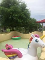 a playground with a toy horse and a ride at Muho B&amp;B in Dongshan
