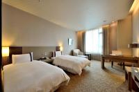 Shinkansen Grand Hotelにあるベッド