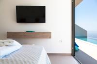 Posteľ alebo postele v izbe v ubytovaní SIVOTA SUNSET VILLAS