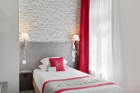 a hotel room with a bed with a red curtain at Best Western Hotel Saint Claude in Péronne