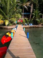 a dock with boats on a body of water at Carmen&#39;s place in Bastimentos