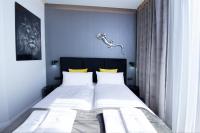 Posteľ alebo postele v izbe v ubytovaní Apartament Lagarto