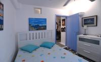 Postel nebo postele na pokoji v ubytování Tinos Traditional Sea Side Villa