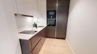 Kuchyň nebo kuchyňský kout v ubytování White Pearl Apartment 2.10