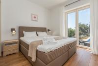 Postel nebo postele na pokoji v ubytování Villa Laura An
