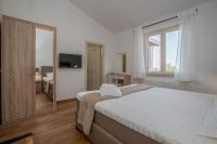 Postel nebo postele na pokoji v ubytování Villa Laura An