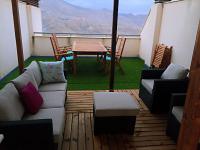 Posezení v ubytování Apartamentos Deluxe Roquetas de Mar con Golf y Piscina Climatizada, Parking privado