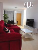 TV a/nebo společenská místnost v ubytování Apartamentos Deluxe Roquetas de Mar con Golf y Piscina Climatizada, Parking privado