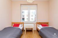 Postel nebo postele na pokoji v ubytování Jantar Apartamenty - Family Vacation Polanki