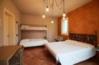 A bed or beds in a room at B&B Casa Campagnari