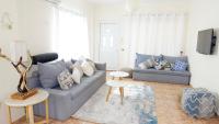 Posezení v ubytování Melanos Residence 2 bdrm townhouse with private pool
