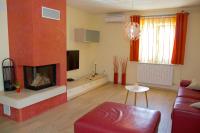 Televízia a/alebo spoločenská miestnosť v ubytovaní Apartments Polenta