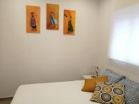 Łóżko lub łóżka w pokoju w obiekcie Apartamentos Playa Benitez