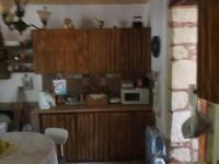 A kitchen or kitchenette at VLASSIS APTS -ΜΕΛΙΔΟΝΙ-ΔΙΑΜΕΡΙΣΜΑ ΒΑΣΙΛΙΚΗ